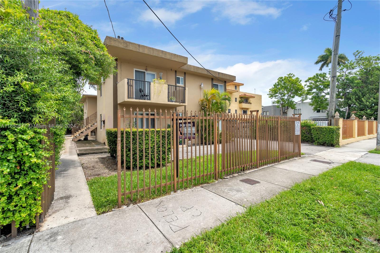 1361 Southwest 4th Street Miami, FL 33135 - Photo 3 of 14 a view of a house with a small yard and plants