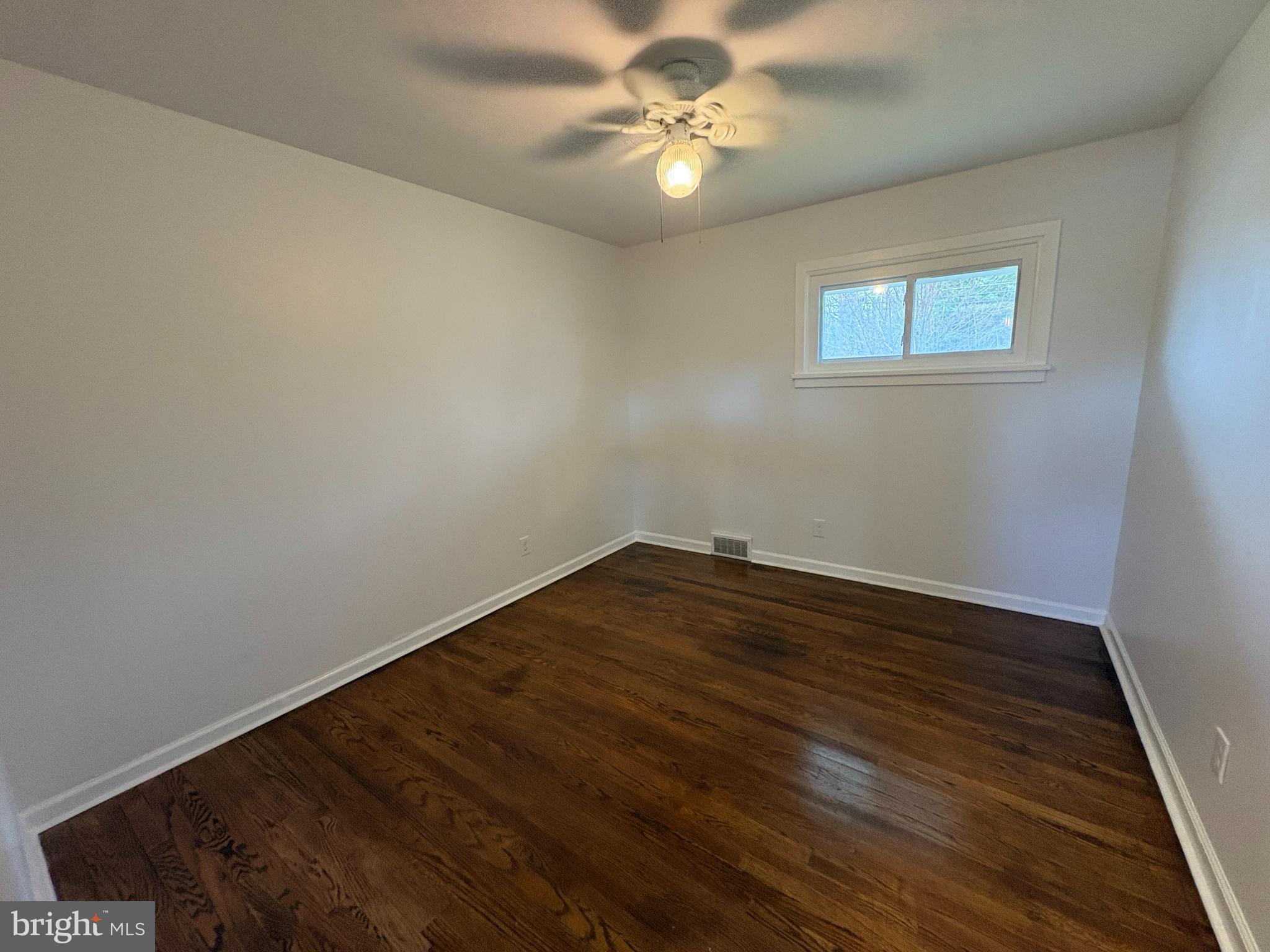18 Crosswicks Chesterfield Road Crosswicks, NJ 08515 - Photo 12 of 20 a view of a room with wooden floor and a ceiling fan