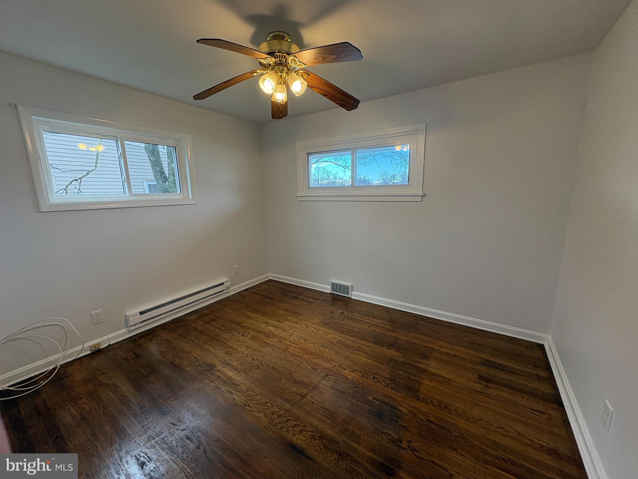 18 Crosswicks Chesterfield Road Crosswicks, NJ 08515 - Photo 13 of 20 a view of an empty room with wooden floor and a chandelier fan