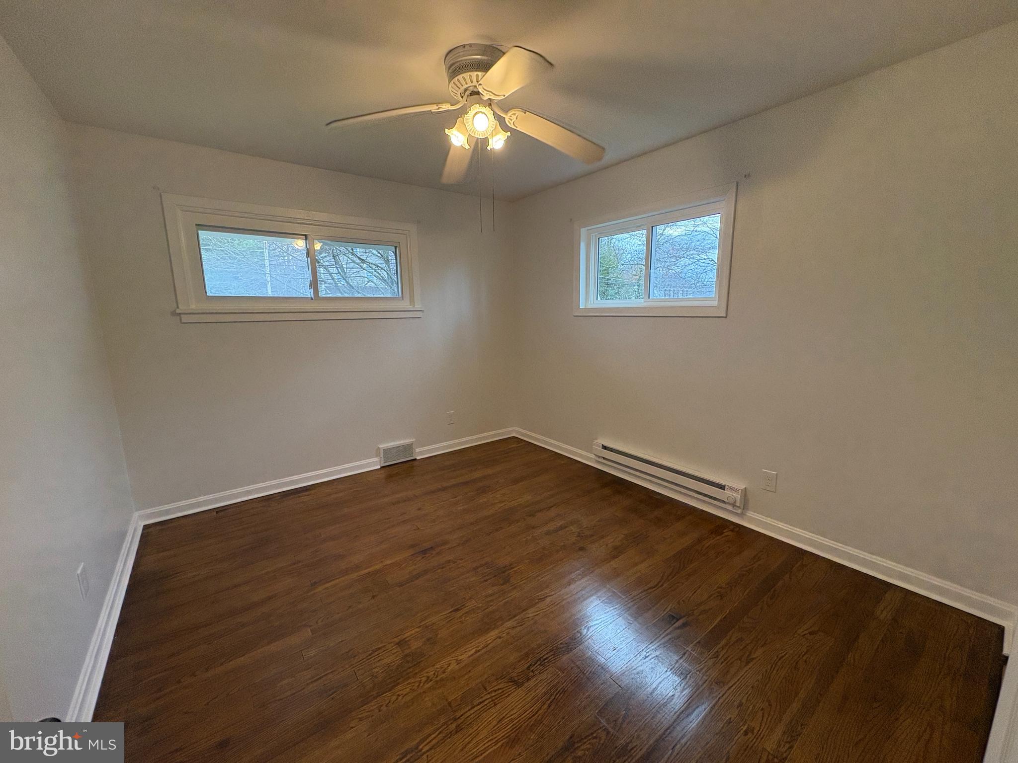 18 Crosswicks Chesterfield Road Crosswicks, NJ 08515 - Photo 14 of 20 a view of a room with wooden floor and a ceiling fan