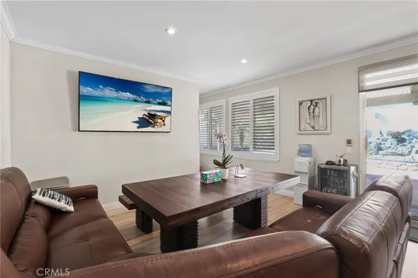 a view of a livingroom with furniture and wooden floor