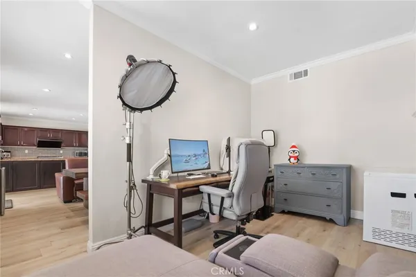 a kitchen with stainless steel appliances granite countertop a refrigerator a stove top oven a sink and dishwasher