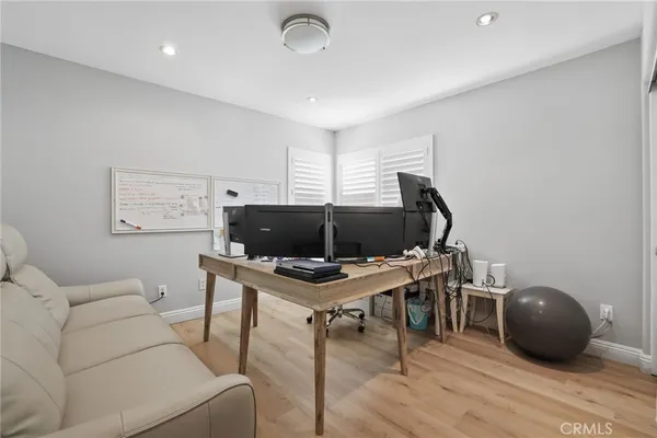 a bedroom with furniture and window