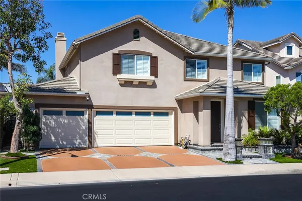 a front view of a house with yard