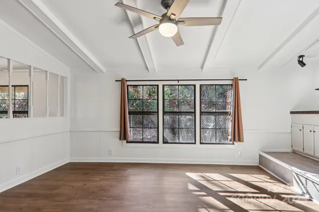 a large kitchen with a stove and a refrigerator