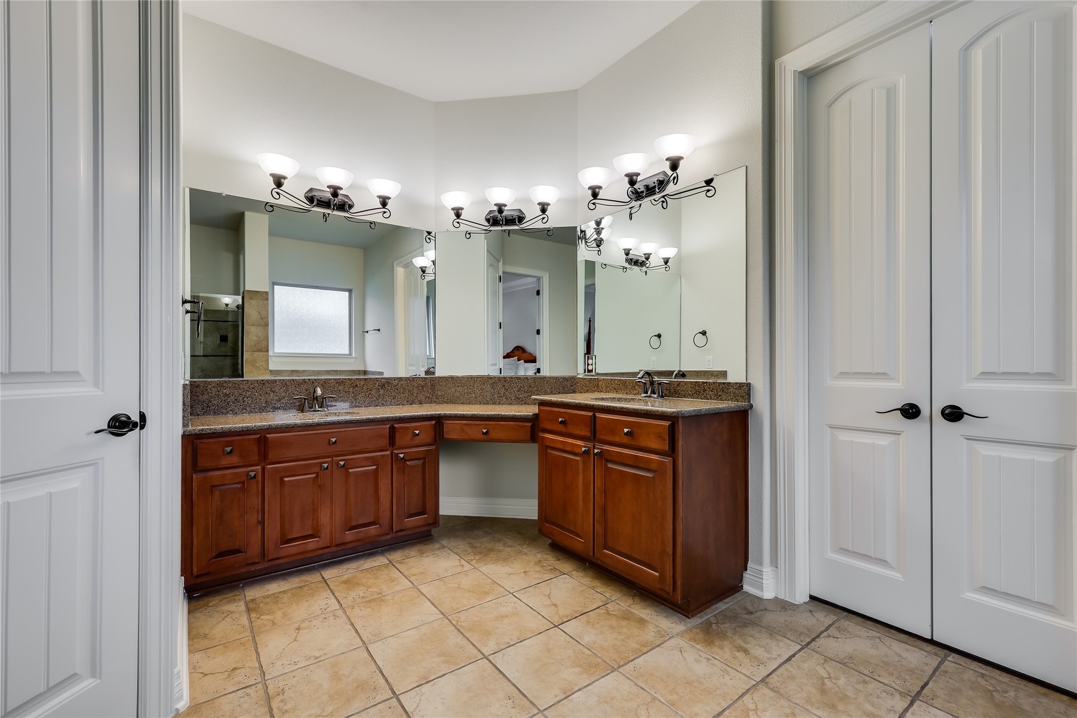 401 Bluff View Road Cedar Park, TX 78613 - Photo 34 of 40 Dual vanities with ample counter space and individual mirrors define this practical bathroom.