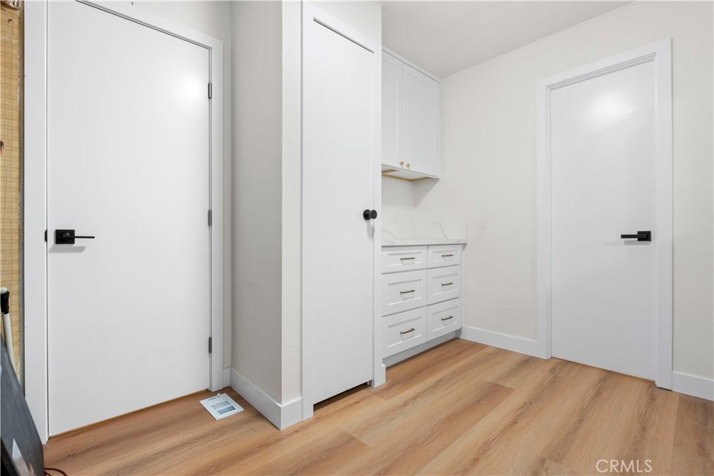 33195 Meyer Road Nuevo, CA 92567 - Photo 21 of 36 an empty room with wooden floor