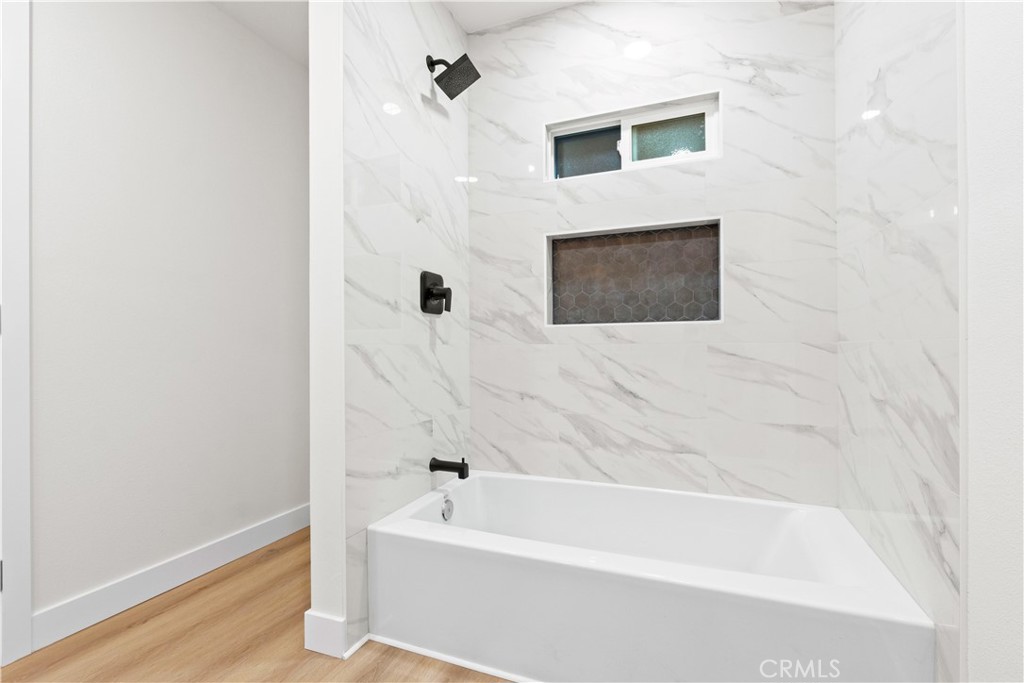 33195 Meyer Road Nuevo, CA 92567 - Photo 26 of 36 a bathroom with a bathtub and a shower
