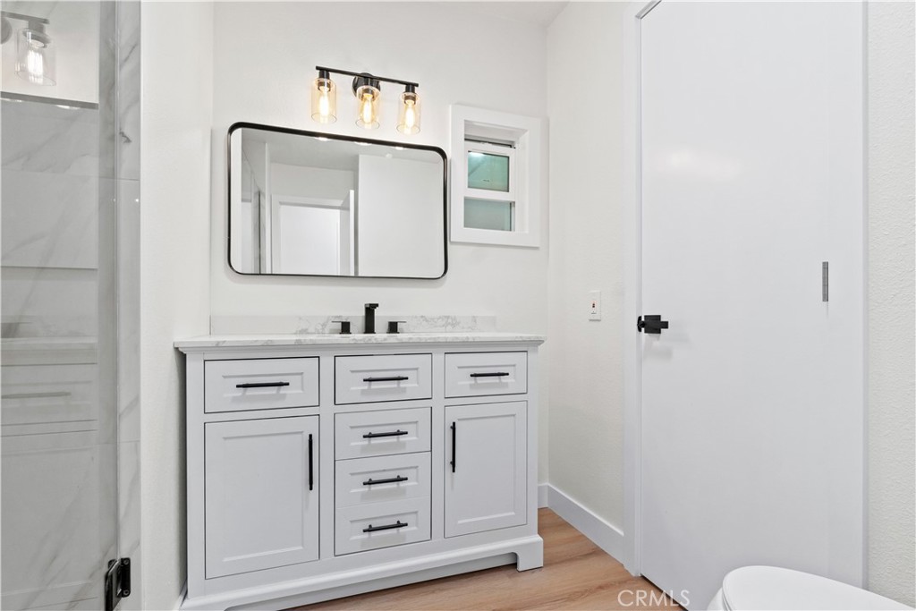 33195 Meyer Road Nuevo, CA 92567 - Photo 29 of 36 a bathroom with mirror a sink and a toilet