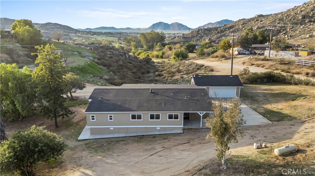 33195 Meyer Road Nuevo, CA 92567 - Photo 30 of 36 an aerial view of a house with a yard