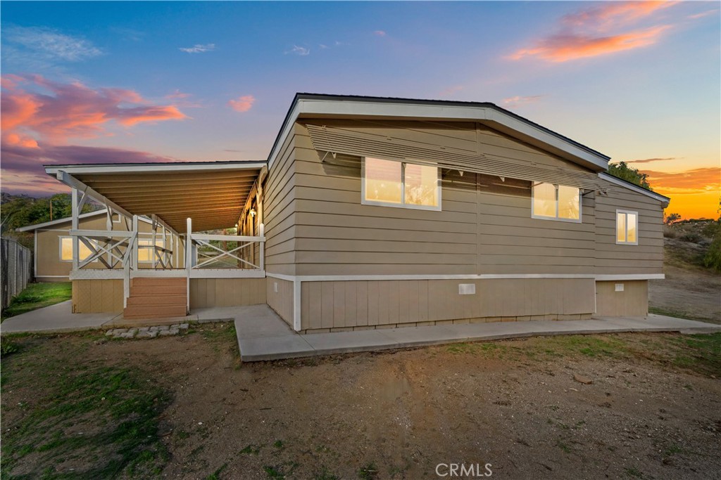 33195 Meyer Road Nuevo, CA 92567 - Photo 4 of 36 a backyard of a house with white walls