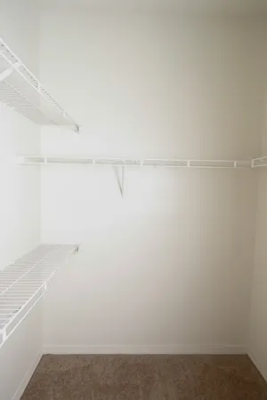 a view of a lake with houses in the back