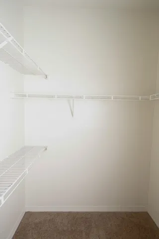 a view of a lake with houses in the back