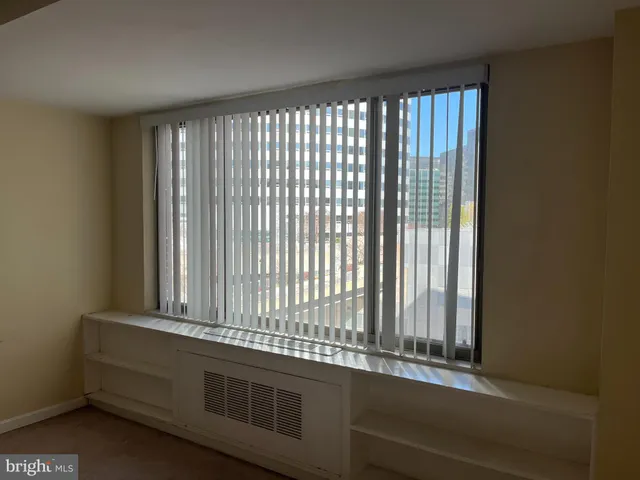 a view of a room that has a window in it