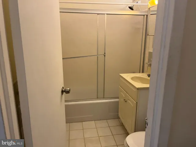 a bathroom with a shower and toilet