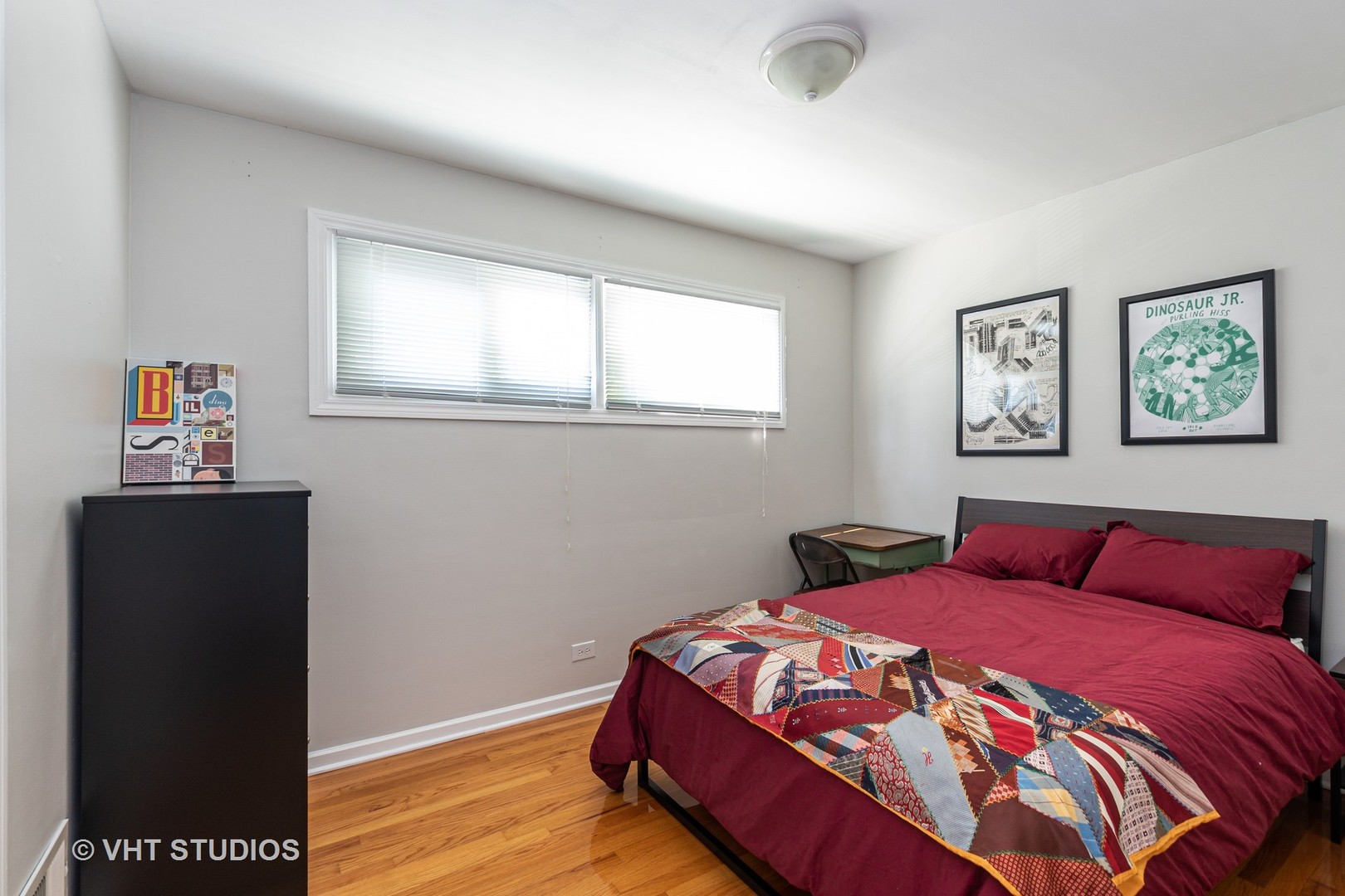 1307 Ridge Road Highland Park, IL 60035 - Photo 6 of 10 a bedroom with a bed and wooden floor