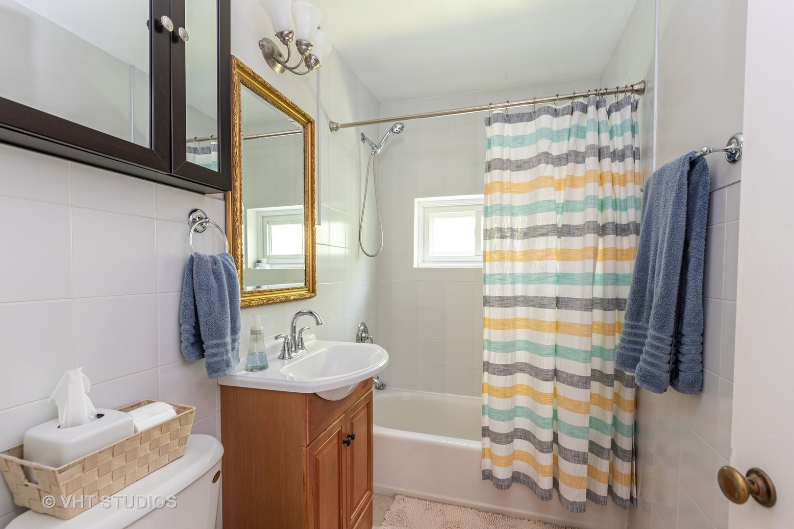 1307 Ridge Road Highland Park, IL 60035 - Photo 7 of 10 a bathroom with a sink toilet and shower