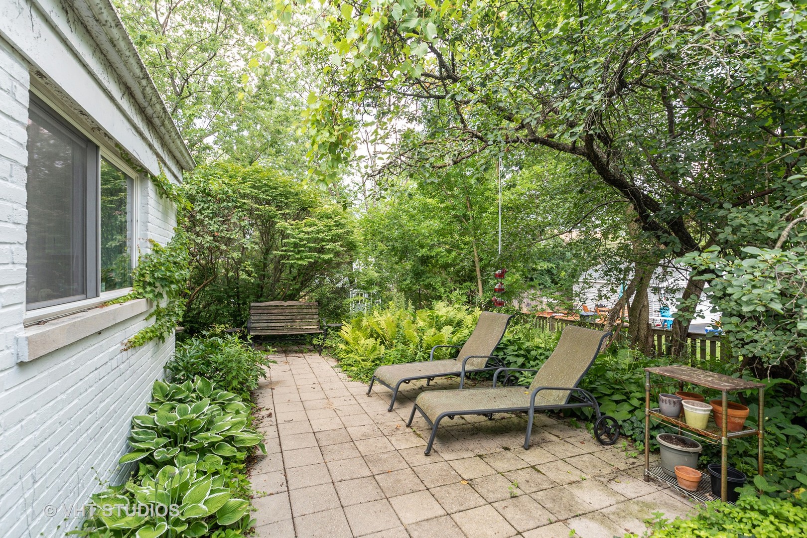 1307 Ridge Road Highland Park, IL 60035 - Photo 9 of 10 a view of a chairs and table in backyard of the house