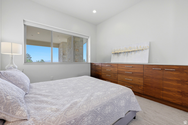 1389 Millbrook Way Bountiful, UT 84010 - Photo 40 of 74 Spacious room featuring a wide horizontal window, recessed lighting, and light-toned flooring