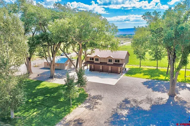 a view of a backyard with sitting area
