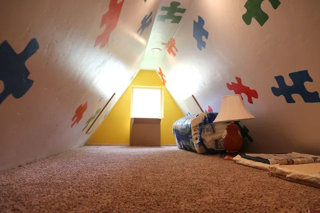 a view of game room with windows