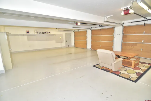 a room with a table and chairs