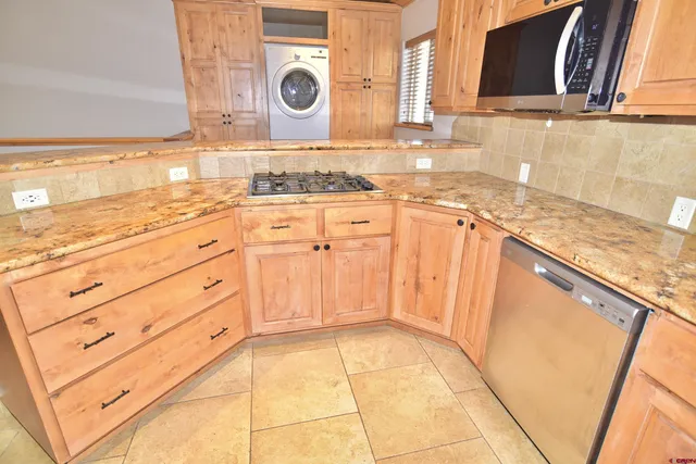 a bathroom with a sink a vanity and granite