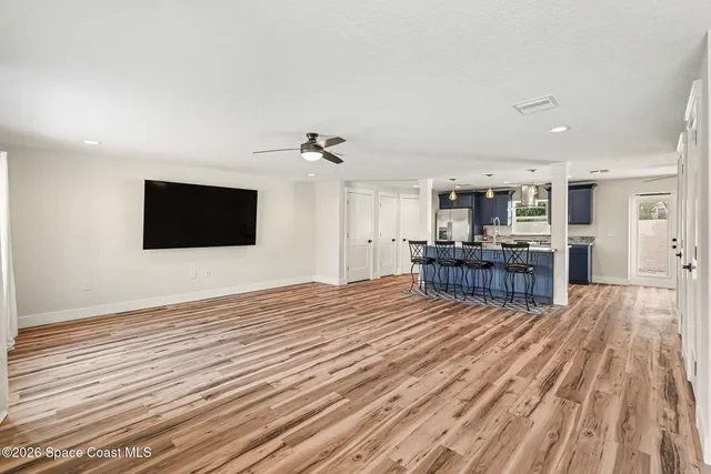 a view of kitchen with wooden floor