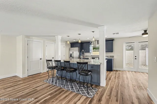 a view of a dining room kitchen counter space and wooden floor