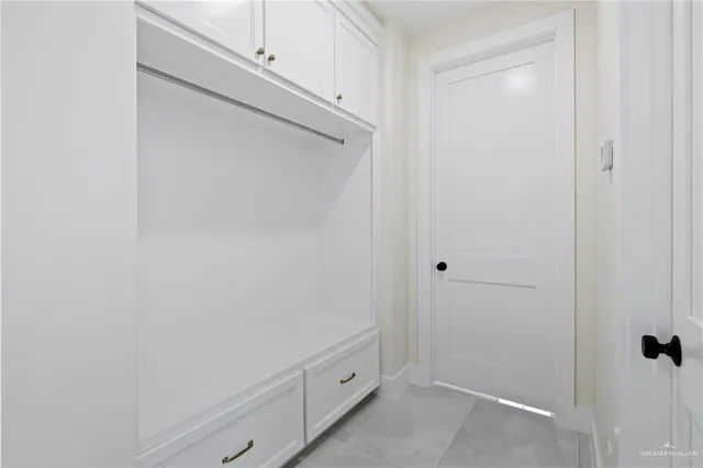 a bathroom with a shower and a sink