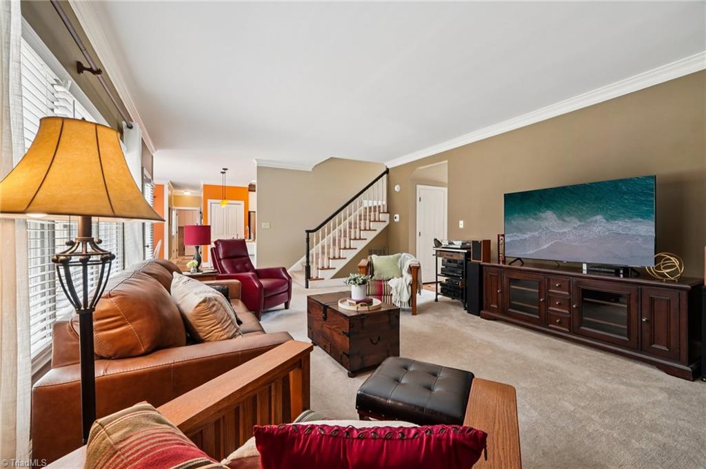 3833 Wesseck Drive High Point, NC 27265 - Photo 14 of 50 Cozy Den space shows the dual staircase to upstairs