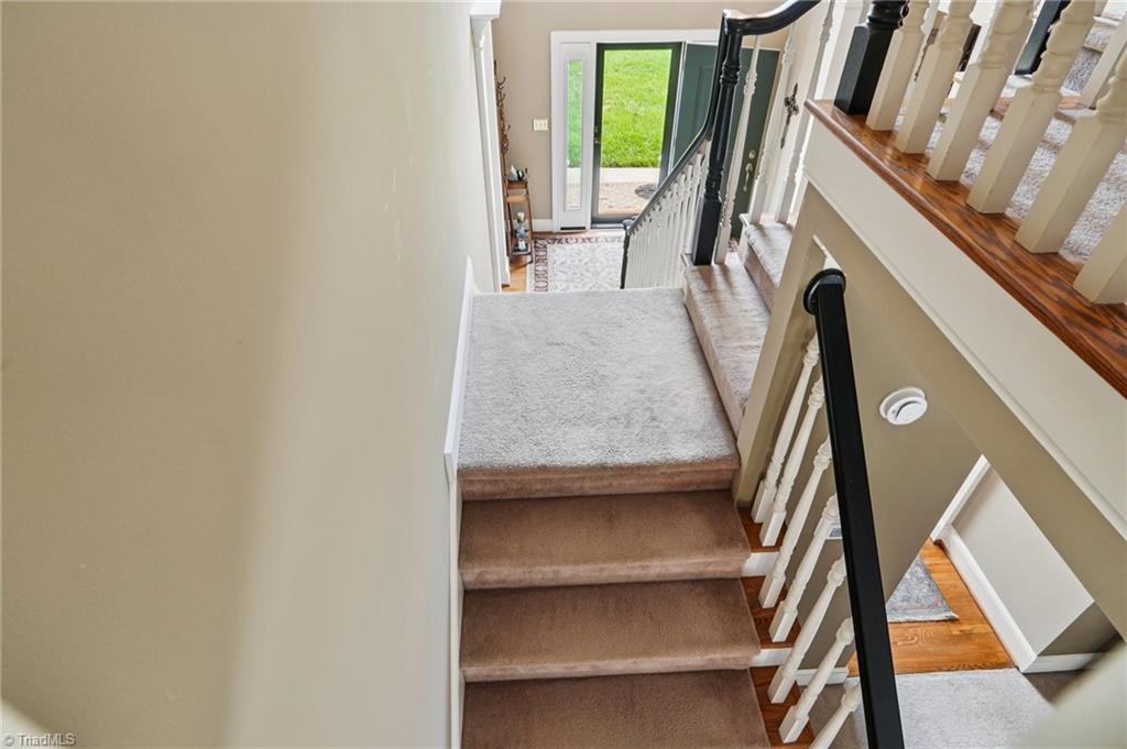 3833 Wesseck Drive High Point, NC 27265 - Photo 22 of 50 Wow ~ Stairs to foyer and Den!