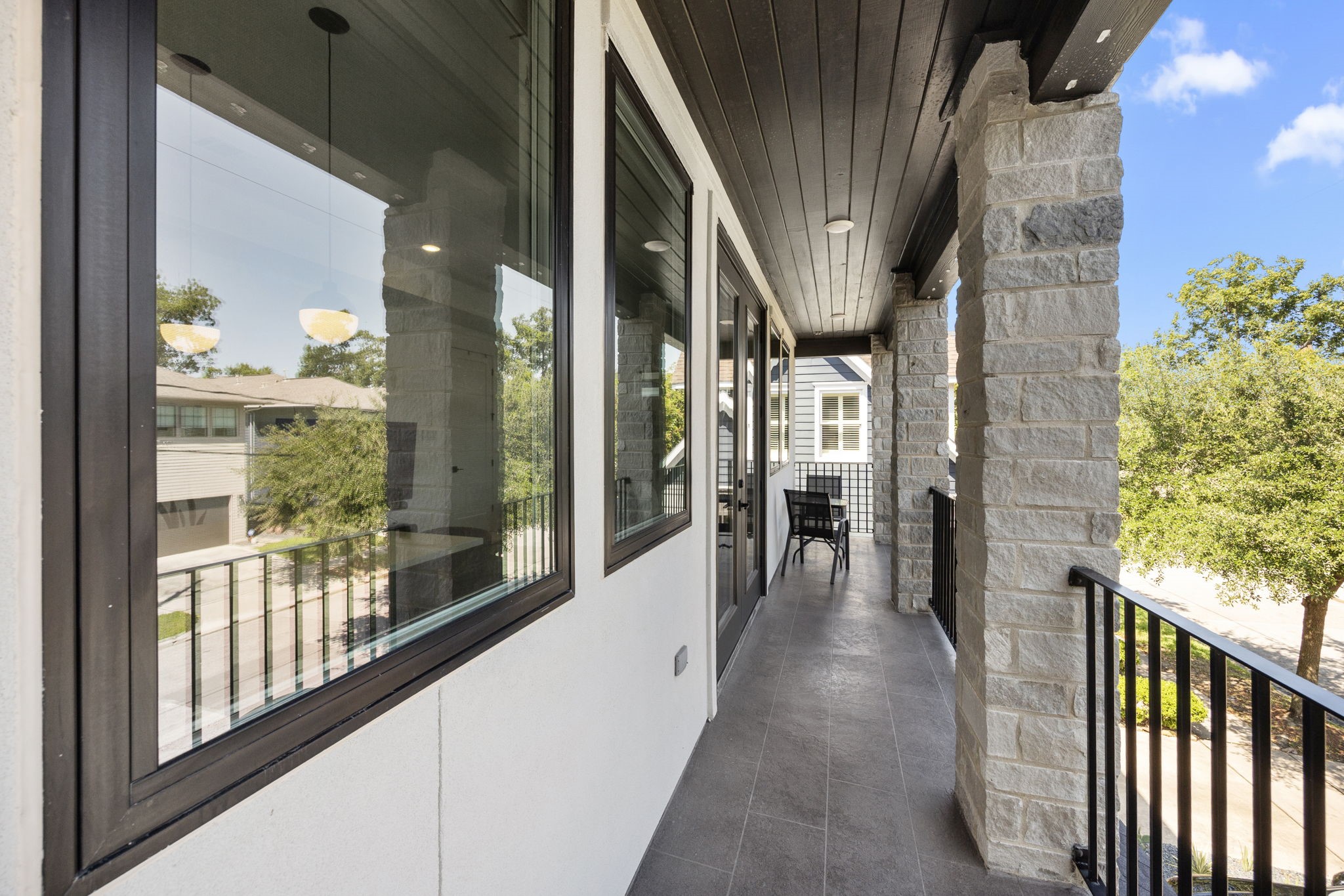 424 Redan Street Houston, TX 77009 - Photo 40 of 47 Balcony overlooking tree lined Redan Street.