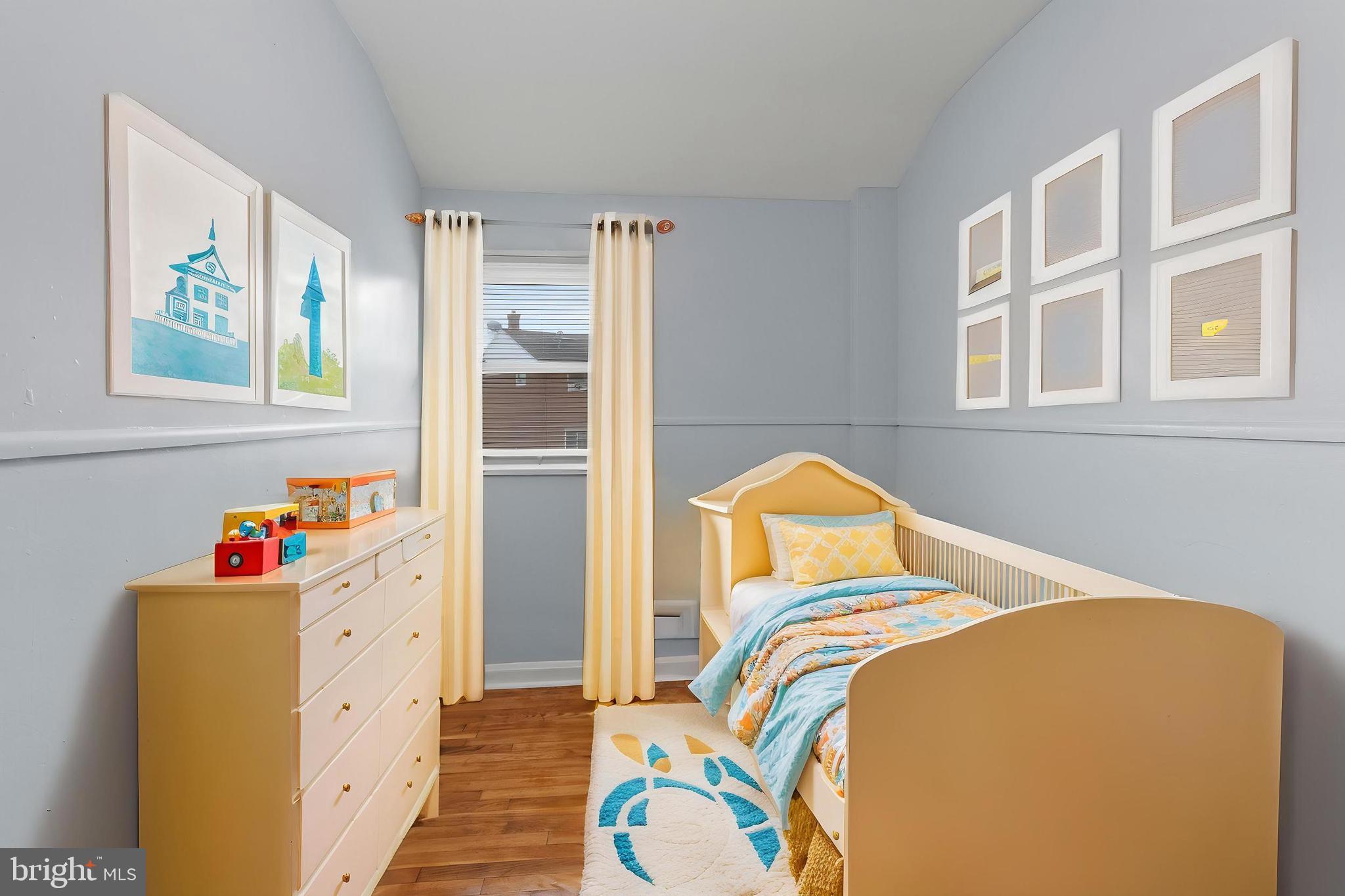 574 Brisbane Road Baltimore, MD 21229 - Photo 21 of 38 a bedroom with a bed and a window