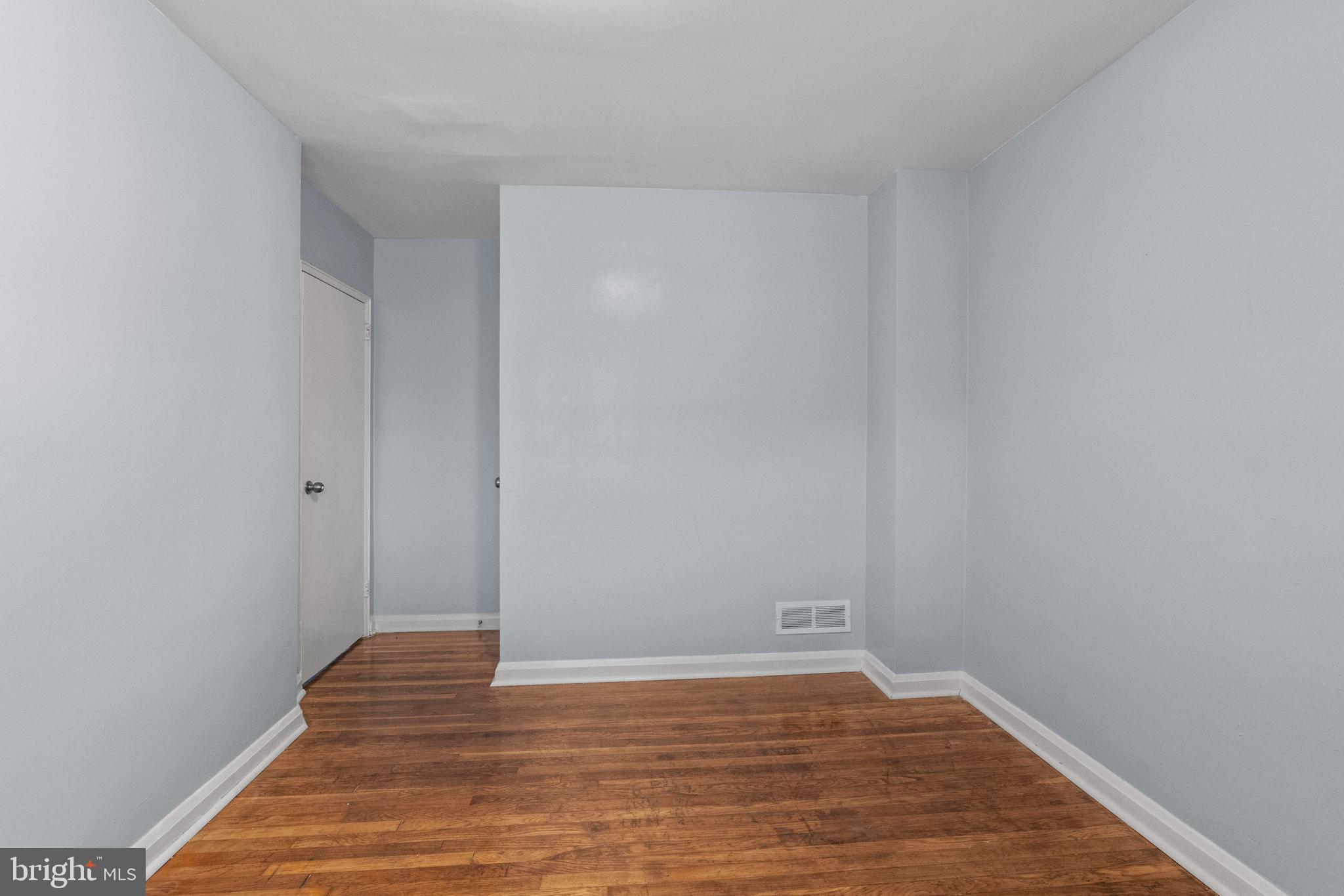 574 Brisbane Road Baltimore, MD 21229 - Photo 26 of 38 a view of an empty room with wooden floor