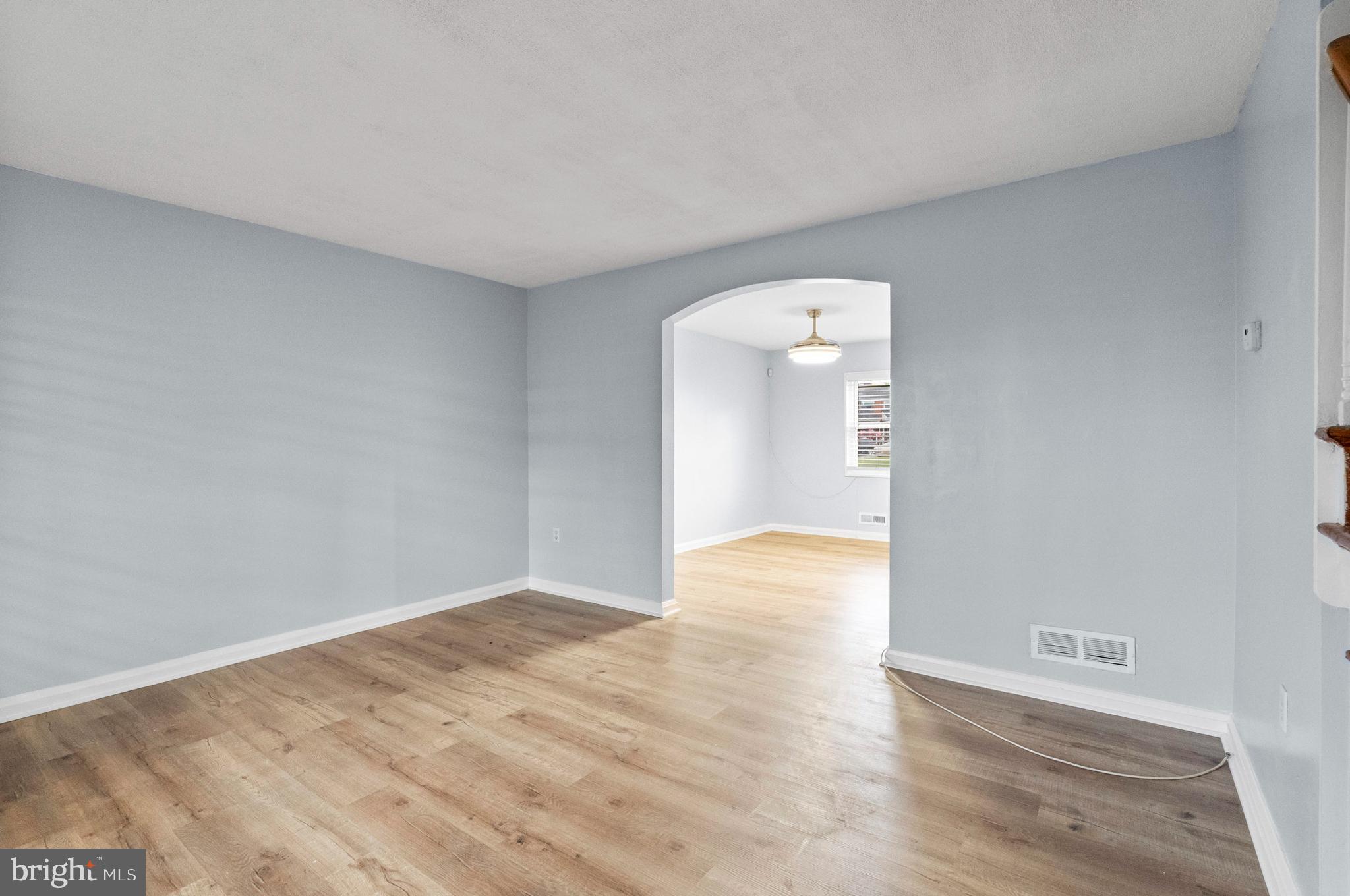 574 Brisbane Road Baltimore, MD 21229 - Photo 7 of 38 a view of an empty room and wooden floor