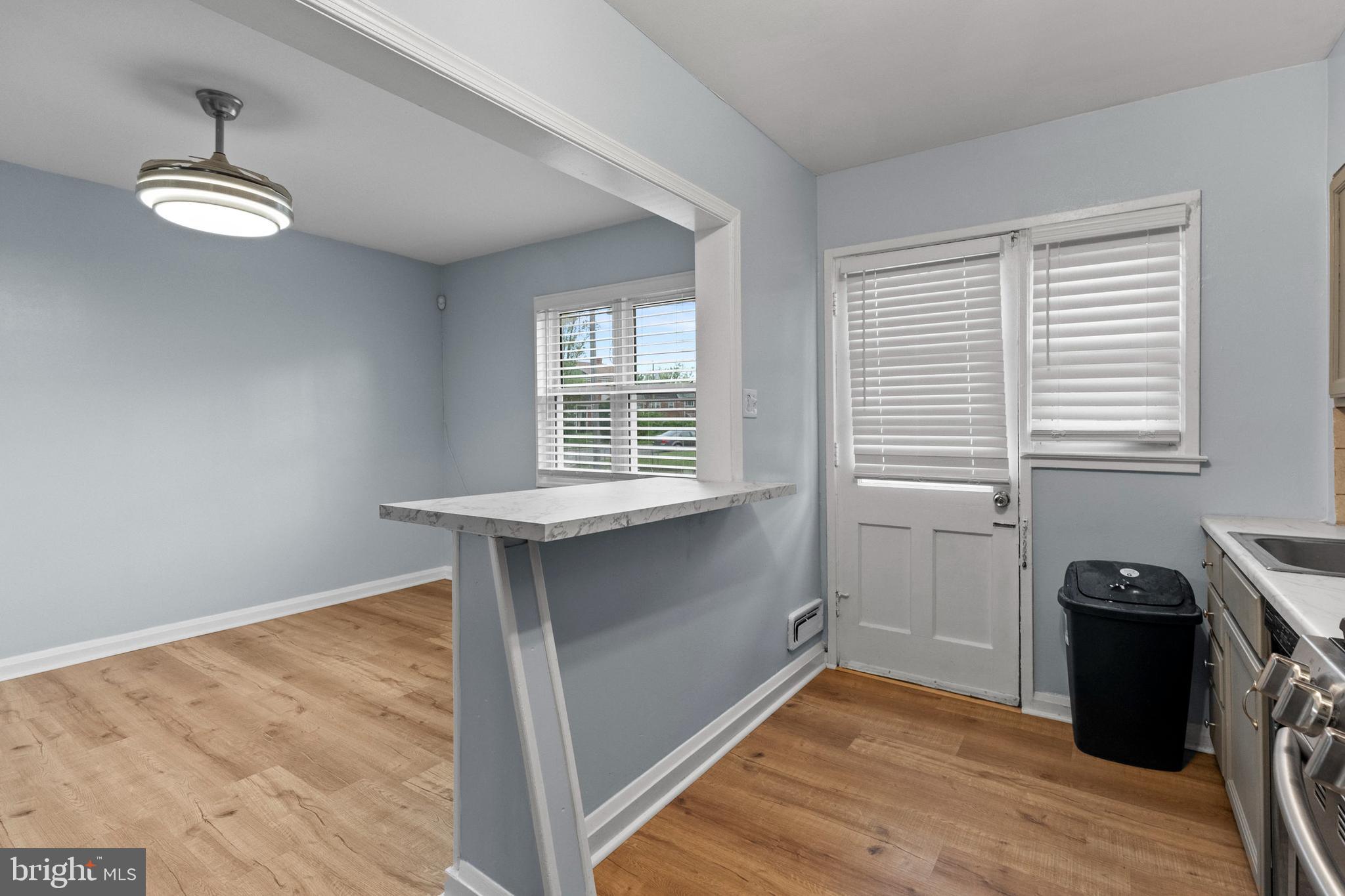 574 Brisbane Road Baltimore, MD 21229 - Photo 10 of 38 a view of a room with wooden floor and windows