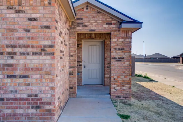 a view of front door of a house with an empty space