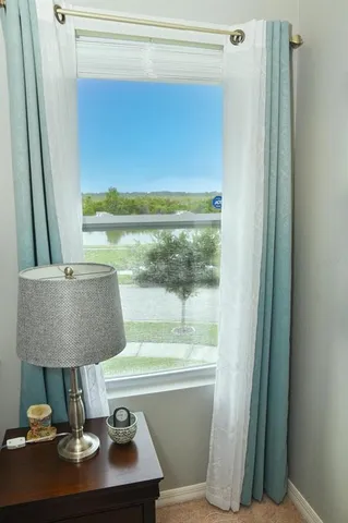 a bathroom with a granite countertop shower sink and mirror