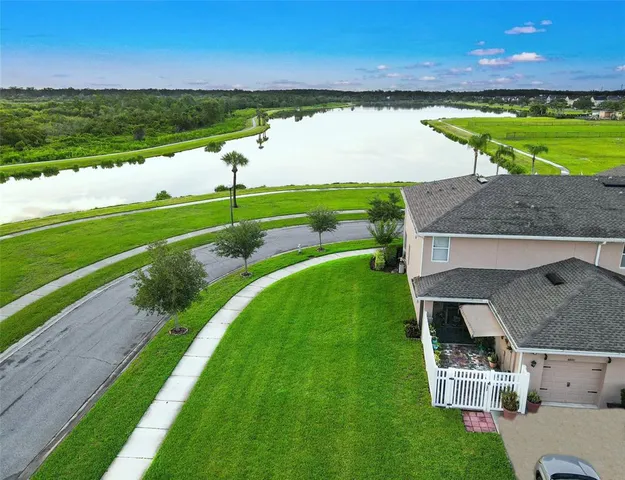 a view of a big house with a big yard