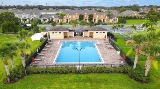 an aerial view of a house with outdoor space