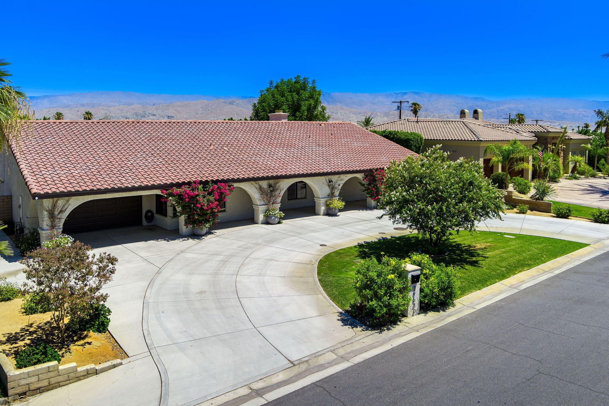 79540 Bermuda Dunes Drive Bermuda Dunes, CA 92203 - Photo 1 of 27 a view of a patio with table and chairs and potted plants