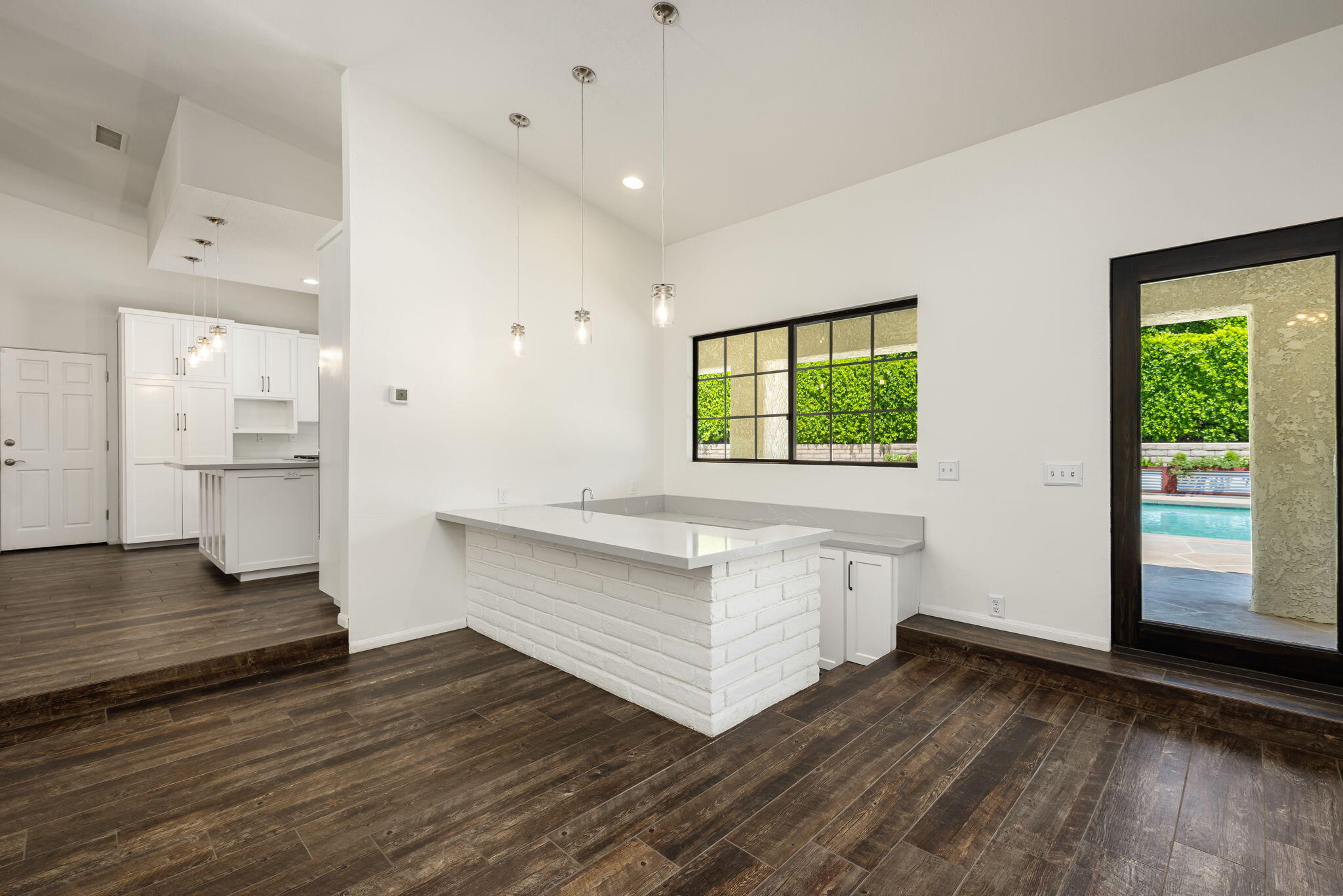 79540 Bermuda Dunes Drive Bermuda Dunes, CA 92203 - Photo 11 of 27 a room view with wooden floor and windows