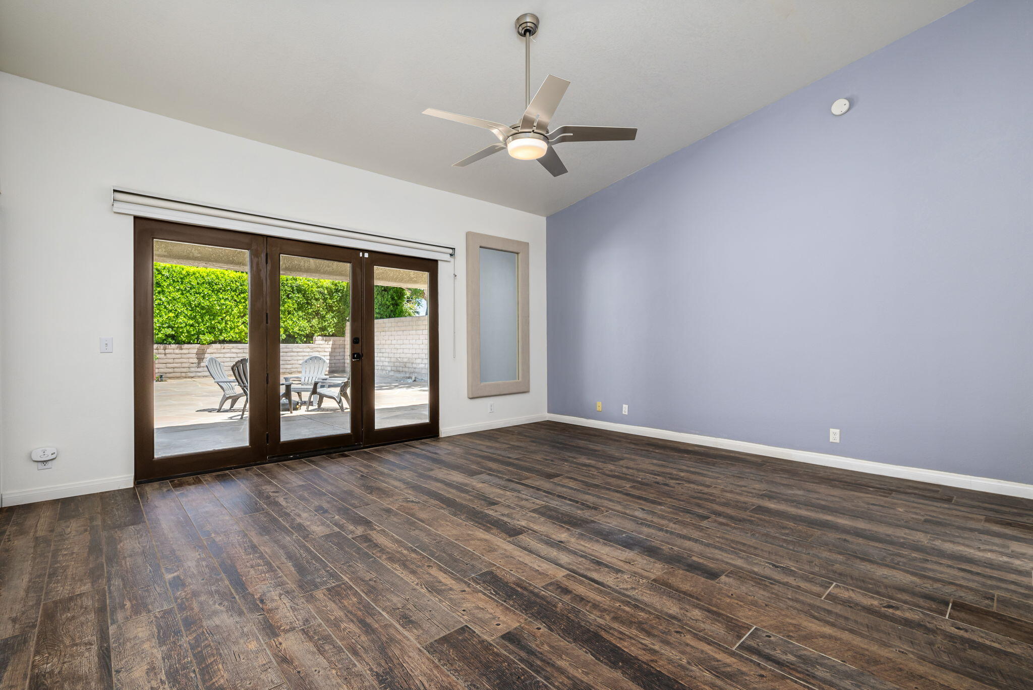 79540 Bermuda Dunes Drive Bermuda Dunes, CA 92203 - Photo 18 of 27 a view of an empty room with a window and wooden floor