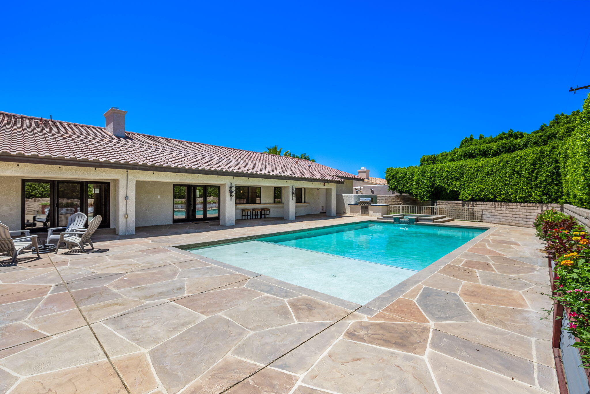 79540 Bermuda Dunes Drive Bermuda Dunes, CA 92203 - Photo 2 of 27 a front view of a house with a garden