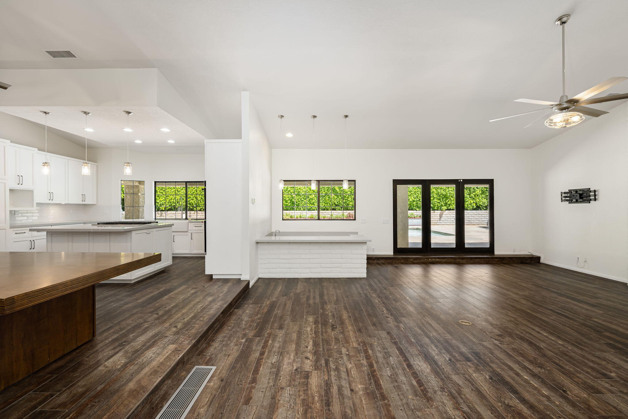79540 Bermuda Dunes Drive Bermuda Dunes, CA 92203 - Photo 8 of 27 an empty room with wooden floor and windows