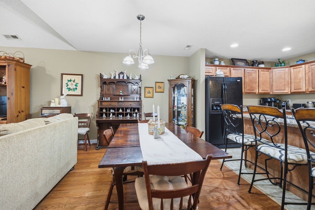109 Abigail Lane Anderson, SC 29621 - Photo 13 of 29 This inviting space combines dining and kitchen areas, featuring elegant hardwood floors and ample natural light.