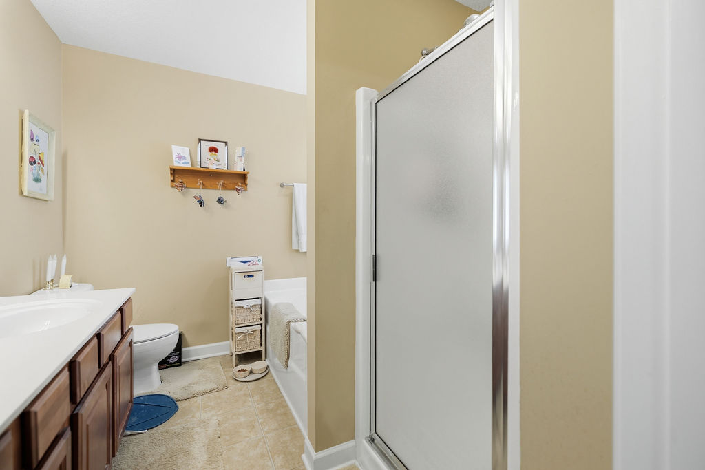 109 Abigail Lane Anderson, SC 29621 - Photo 16 of 29 This bright bathroom features a functional layout with a shower and separate tub.