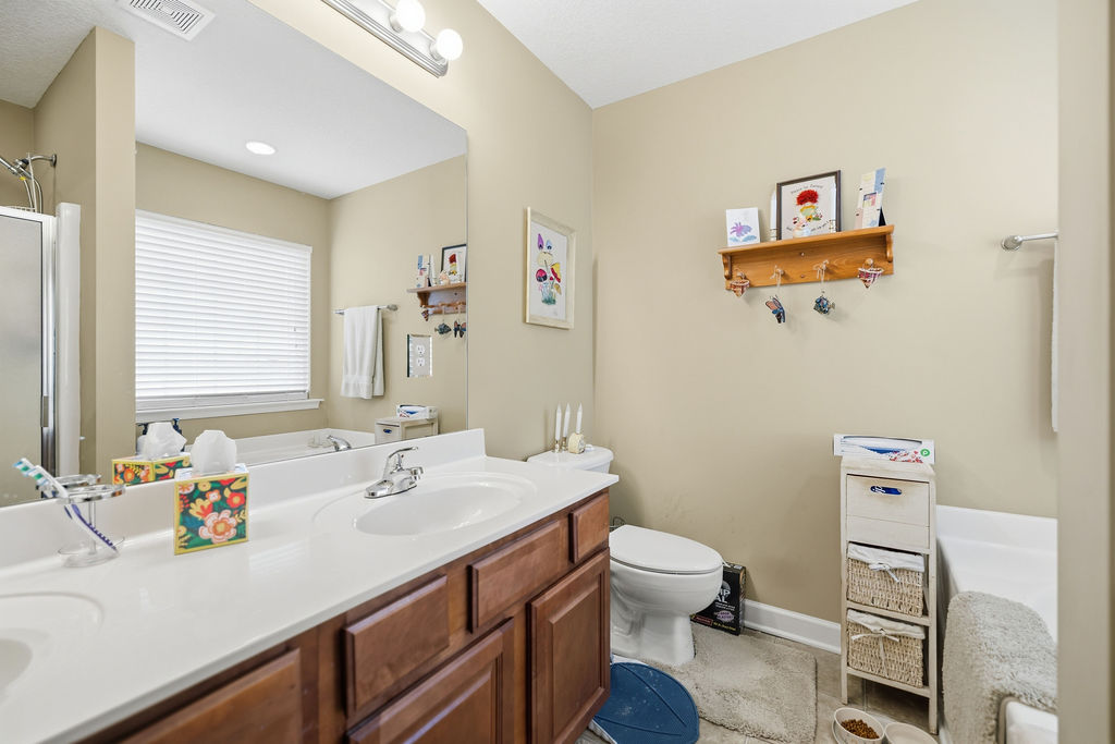 109 Abigail Lane Anderson, SC 29621 - Photo 17 of 29 This bright bathroom features a spacious vanity with dual sinks, perfect for a busy household.