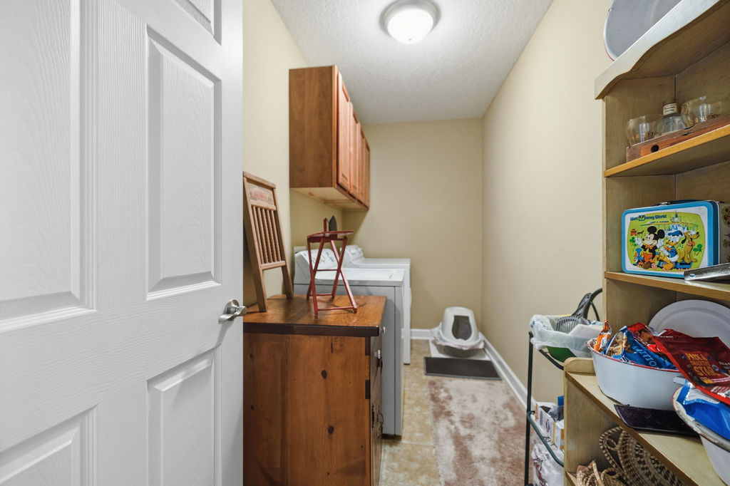 109 Abigail Lane Anderson, SC 29621 - Photo 21 of 29 This functional laundry room includes both essential appliances and convenient overhead storage.